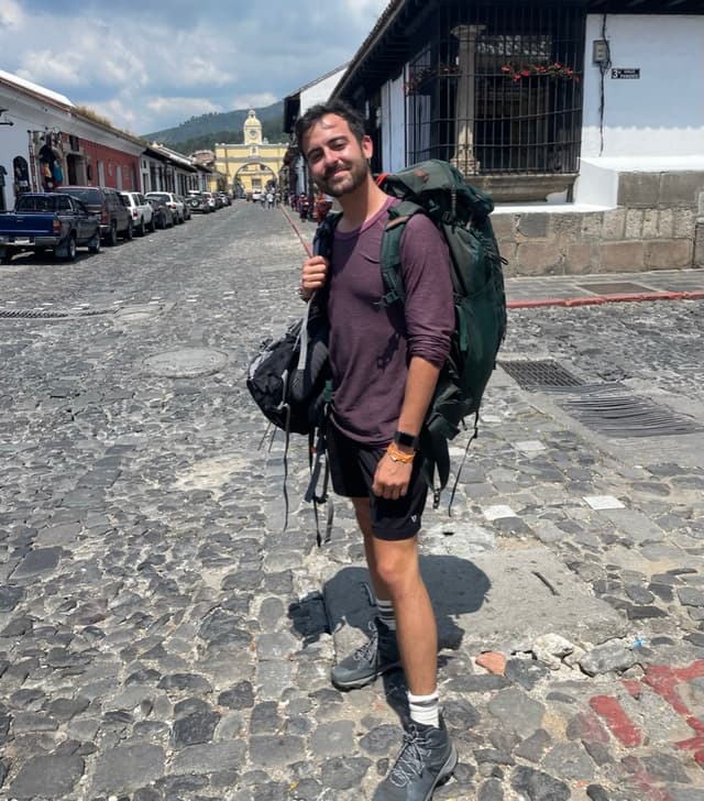 Ben hiking with backpack